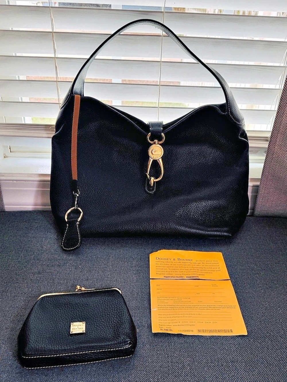 Dooney & Bourke Logo Lock Hobo Leather in Black